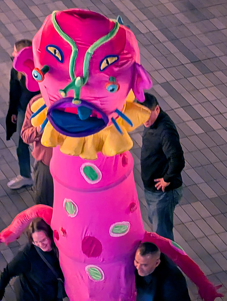 image of a larger than life size pink creature puppet