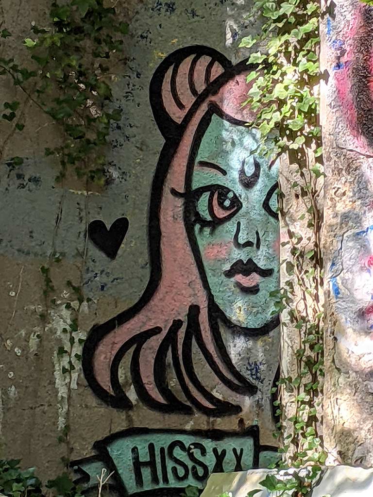 image of a wall covered in graffiti
